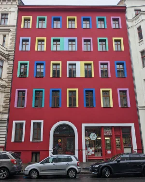 Red house with colourful window frames
