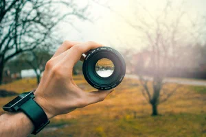 Looking through a camera lens onto a park