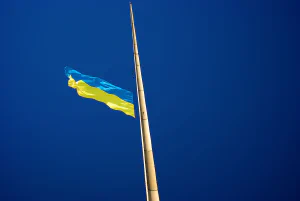 Ukrainian flag on post at halfmast position