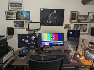 Desk with two monitors and laptop