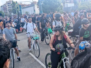 Large group of cyclists in Barcelona, with one DJ on a cargo bike
