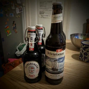 Bottles of alcohol-free Flensburger Frei and Störtebeker Atlantik-Ale on a kitchen table